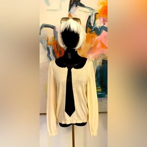 Alice and Olivia wool sweater w/sequins.Color cream or off white and black.NWT.